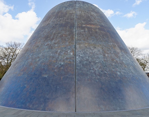 Royal Observatory Greenwich with visitors exploring the historic building and surrounding gardens.