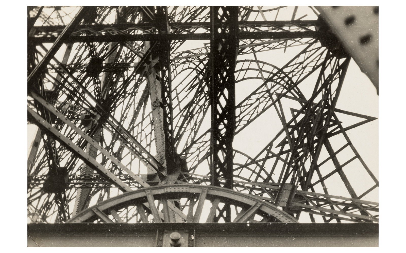 Abstract view of Eiffel Tower structure, featured in Women Photographers (1900-1975) exhibition at National Gallery of Victoria.