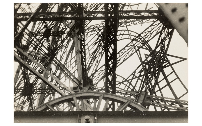 Abstract view of Eiffel Tower structure, featured in Women Photographers (1900-1975) exhibition at National Gallery of Victoria.