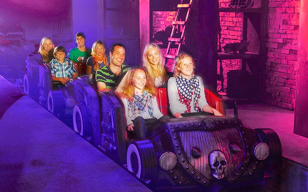 Visitors on a themed ride at Van Helsing's Factory, Movie Park.