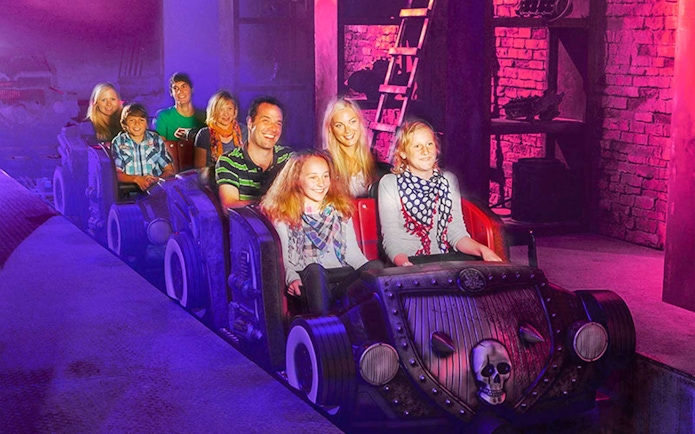 Visitors on a themed ride at Van Helsing's Factory, Movie Park.