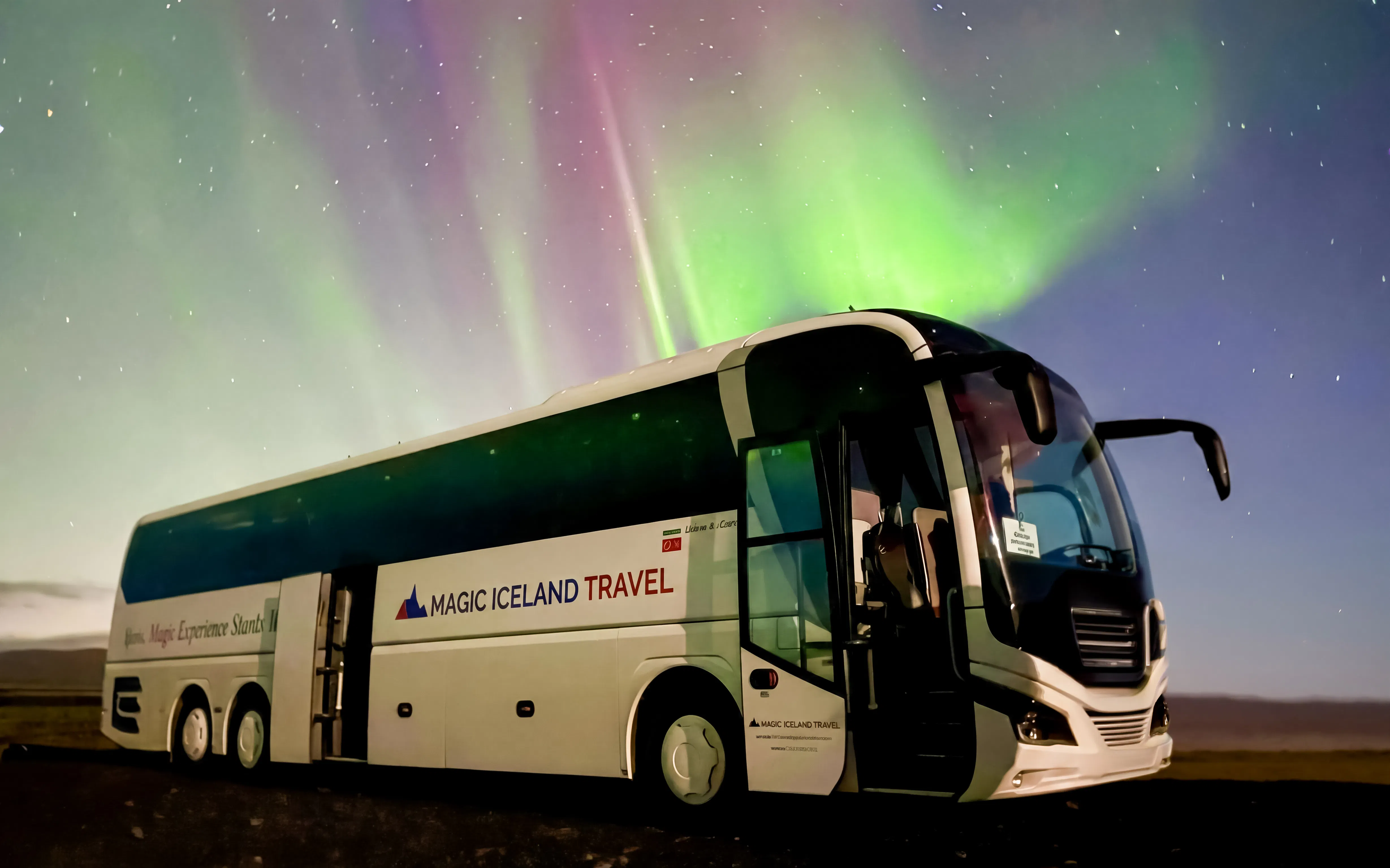 Coach under Northern Lights in Reykjavik, Iceland.