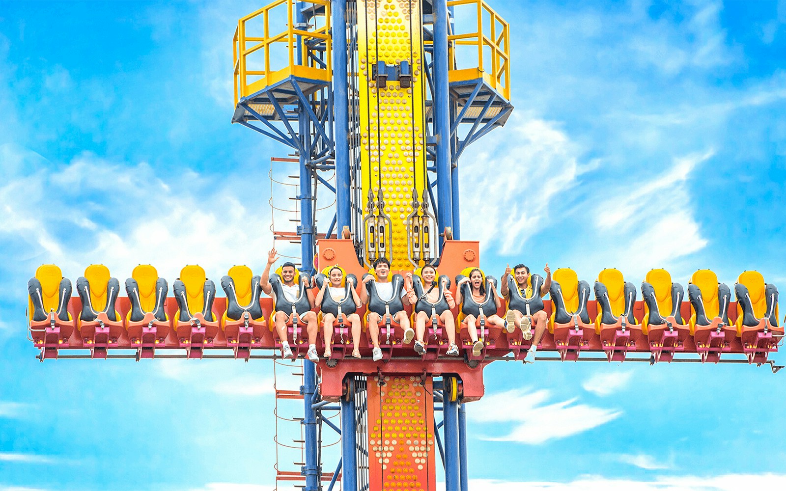 Sky fall ride at VinWonders Nha Trang with people seated, ready for the drop.