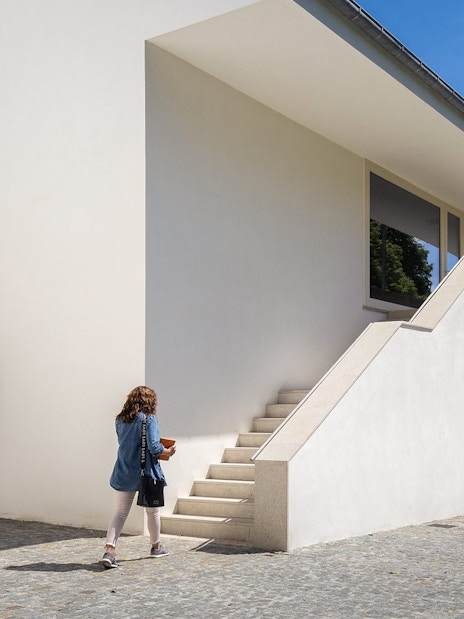 Visitor approaching modern architecture at Serralves, Porto.