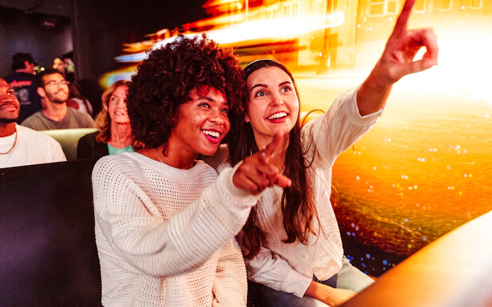 Visitors enjoying an immersive experience at One Times Square, Times Travel tour.