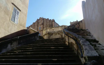 Jesuit Stairs leading to a historic building in Dubrovnik Old Town.