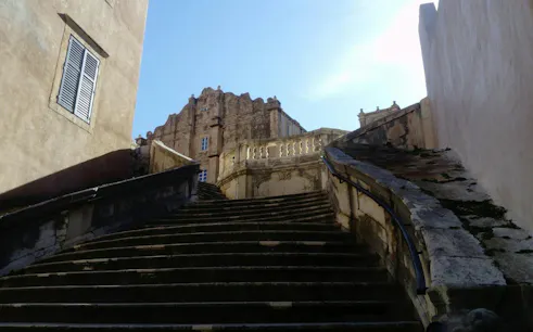 Jesuit Stairs leading to a historic building in Dubrovnik Old Town.