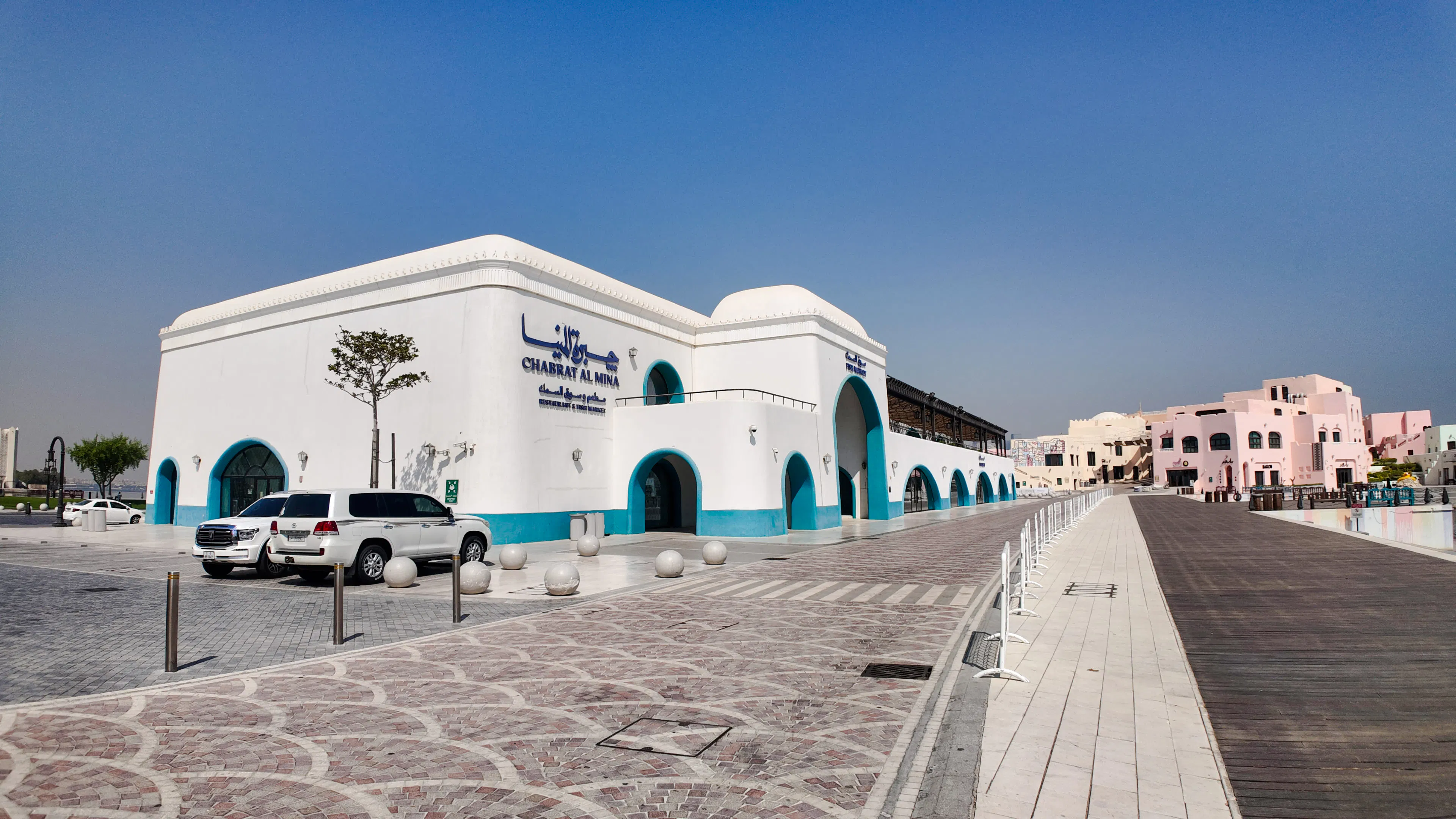Chabrat Al Mina building in Doha with traditional architecture on a sunny day.