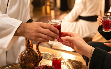 Serving traditional Turkish sherbet in ornate setting, Turkey.