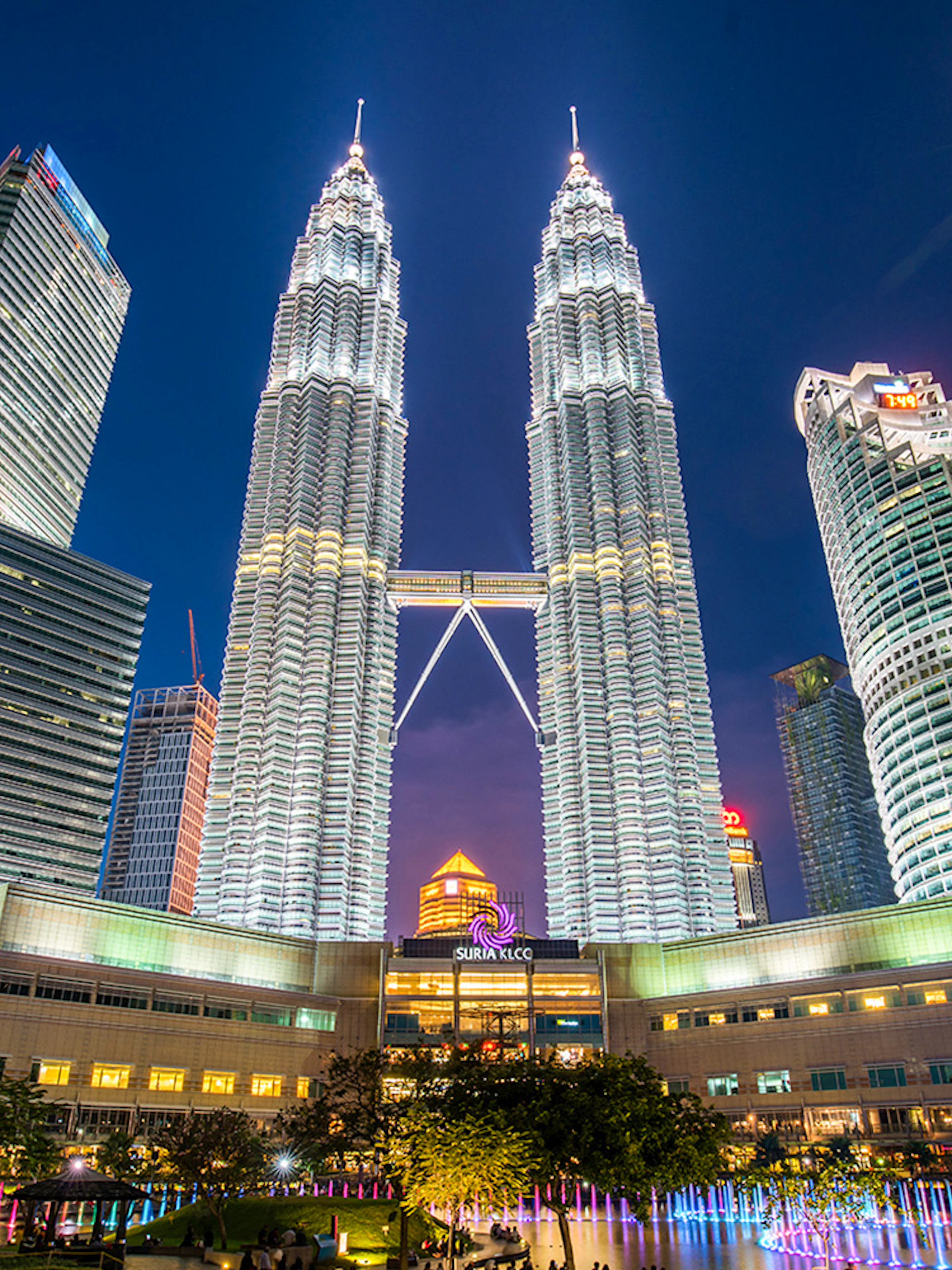 Petronas Twin Towers illuminated at night in Kuala Lumpur, near Petrosains Discovery Centre.