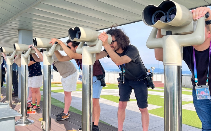 Visitors using binoculars at the DMZ observatory in Korea.