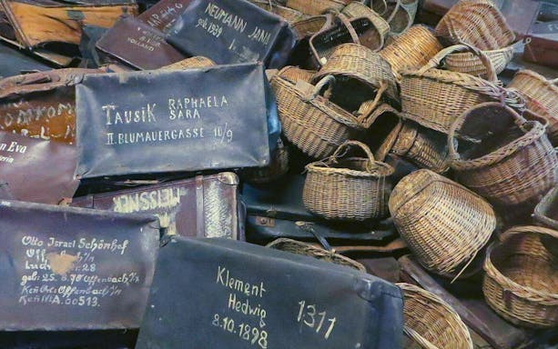Suitcases and baskets from Auschwitz victims, part of a guided tour from Warsaw.