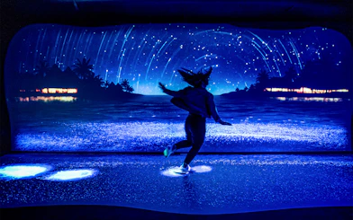Customer enjoying bioluminescence exhibit at SEA LIFE Sydney Aquarium.