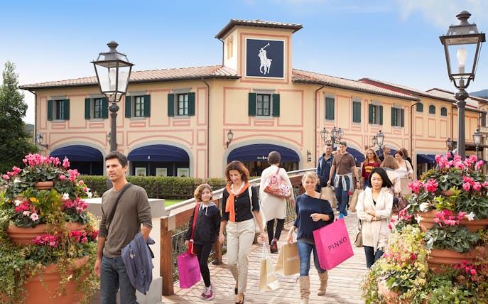 Shoppers walking at Barberino Designer Outlet near Florence.