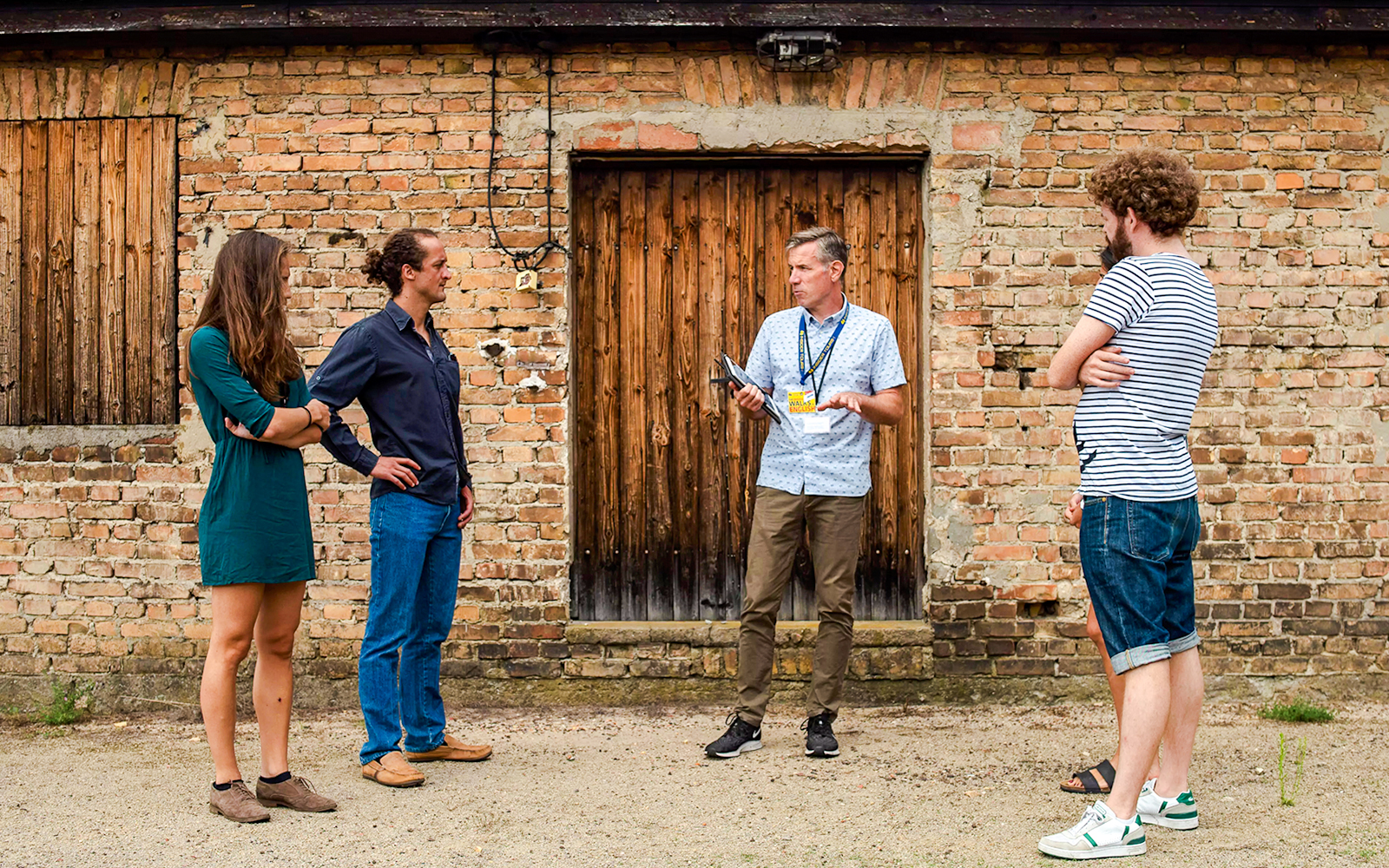 Guests with a tour guide at Sachsenhausen Concentration Camp Memorial, Germany.
