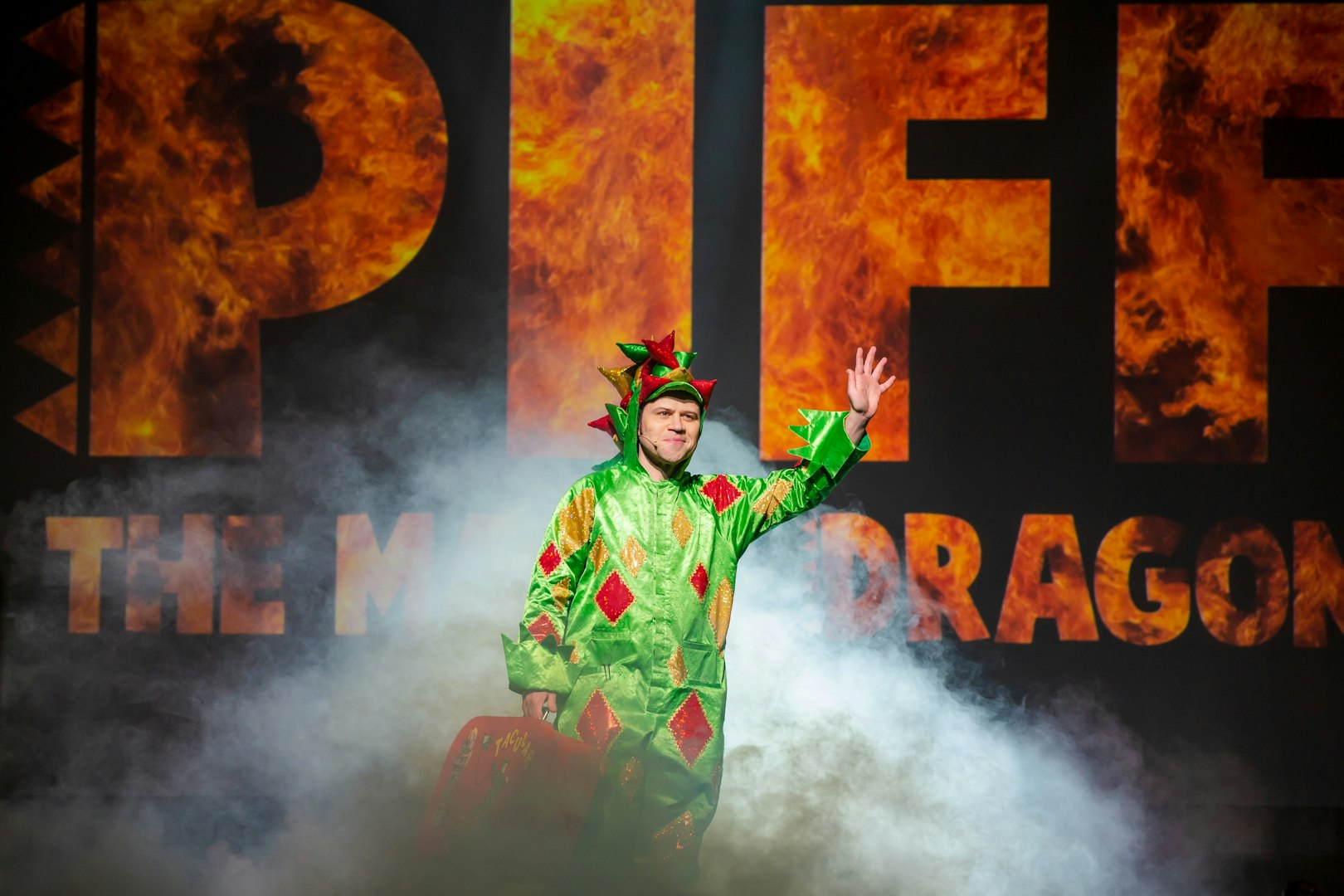 Performer in dragon costume on stage at Piff the Magic Dragon show, Vegas.