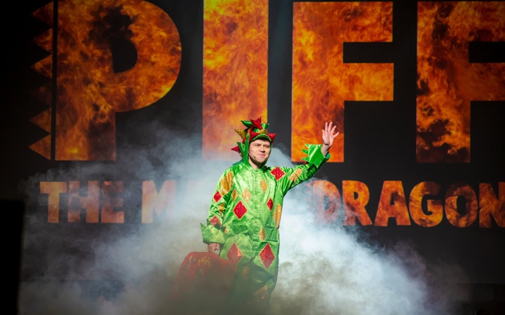 Performer in dragon costume on stage at Piff the Magic Dragon show, Vegas.