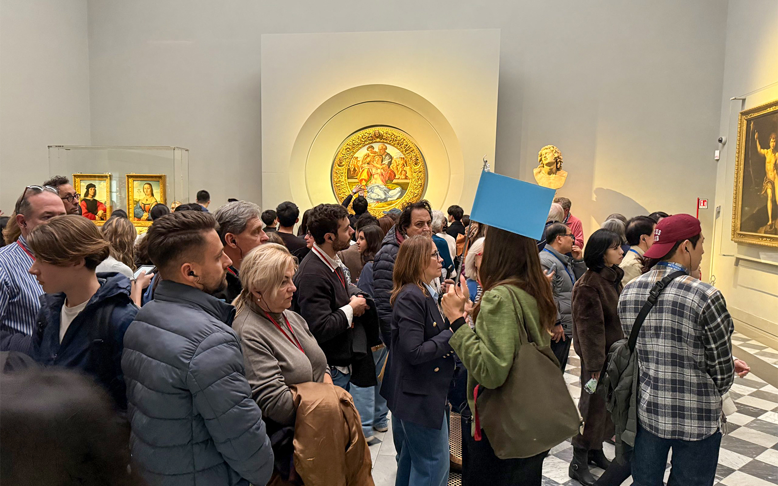 Visitors viewing art exhibits during a private tour at the Uffizi Gallery, Florence.