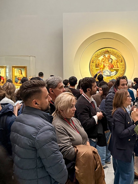 Visitors viewing art exhibits during a private tour at the Uffizi Gallery, Florence.