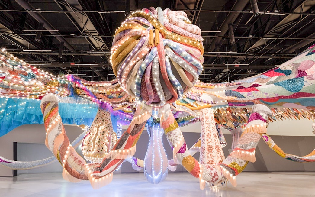 Colorful textile installation with lights at MAAT Gallery, Lisbon.