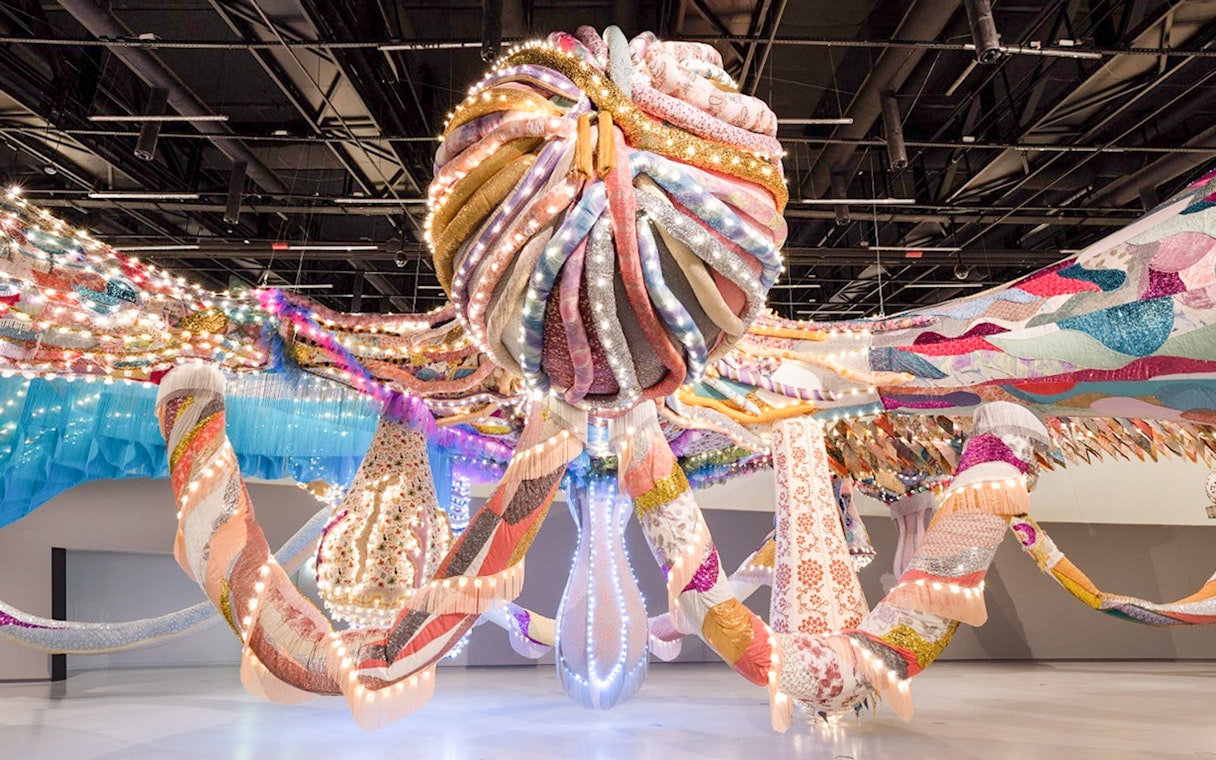 Colorful textile installation with lights at MAAT Gallery, Lisbon.