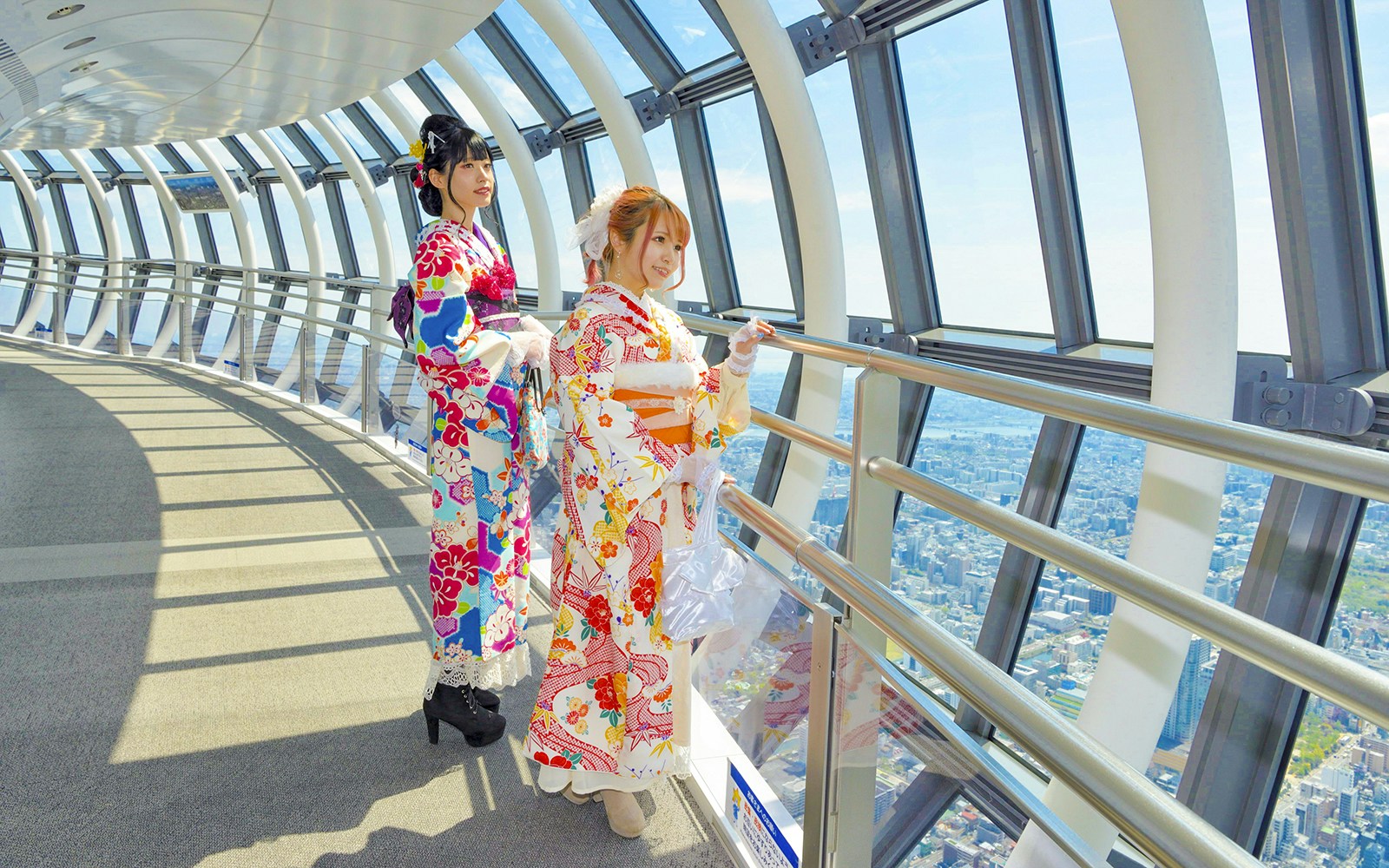 Tokyo Skytree view with tourists in traditional kimonos, highlighting the cultural experience.