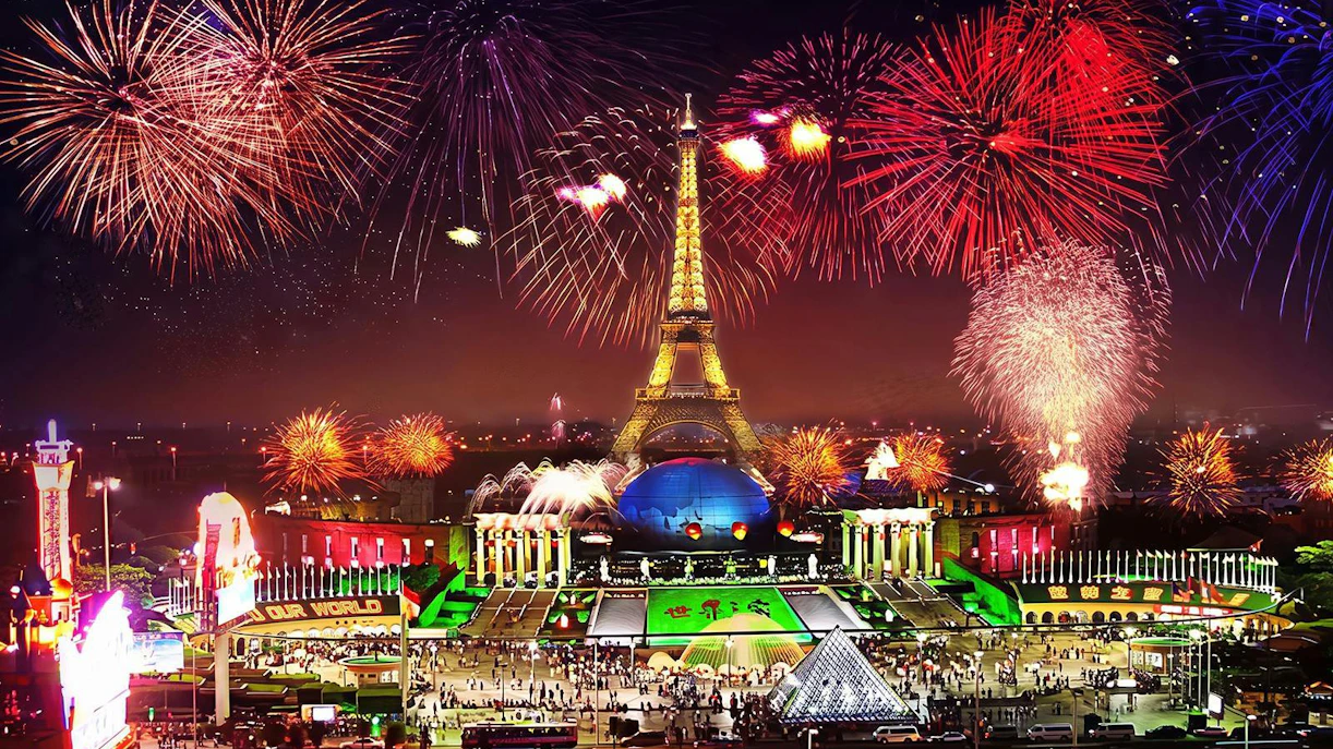Nighttime fireworks over Eiffel Tower replica at Window of the World, Shenzhen, China.