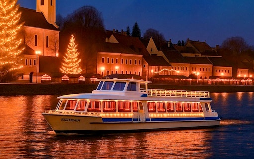 Cruise boat on the Danube River with Christmas lights near Szentendre Market.