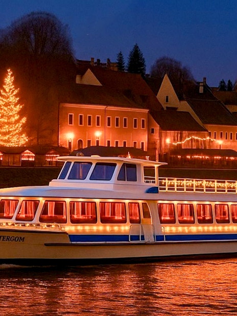 Cruise boat on the Danube River with Christmas lights near Szentendre Market.