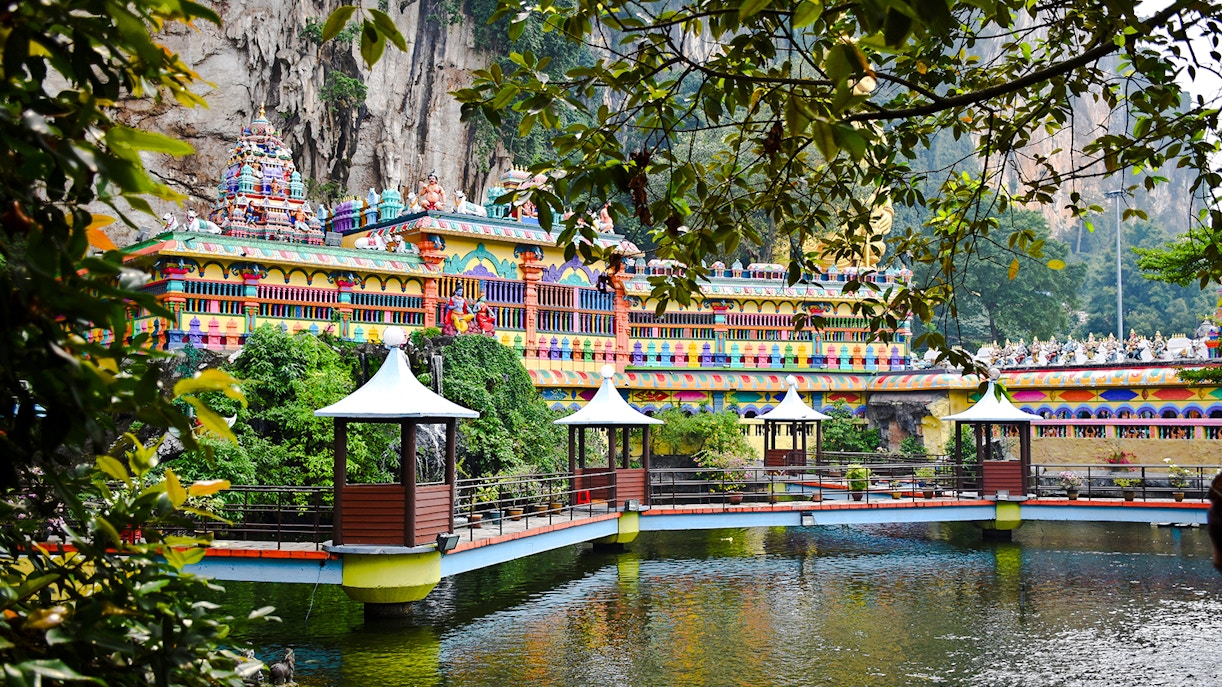 Batu Caves entrance with colorful steps leading to Caves Villa, Malaysia.