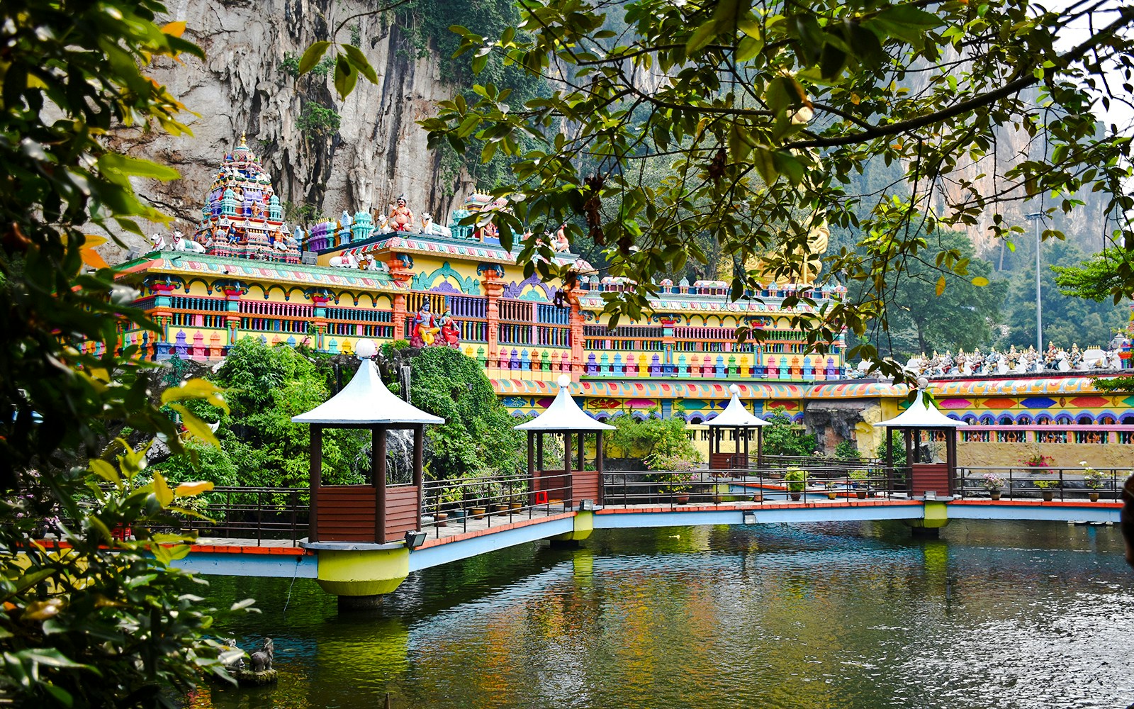 Colorful temple facade and bridge at Caves Villa, Batu Caves, Malaysia.