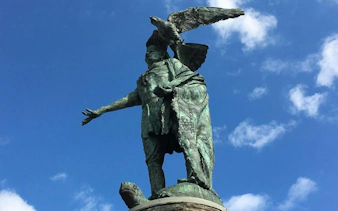 Statue of Native American with eagle in Philadelphia Old Town.