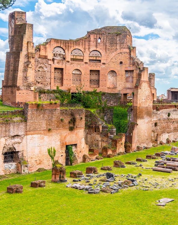Ancient ruins of the Stadium of Domitian in Rome, showcasing brick arches and stone remnants.