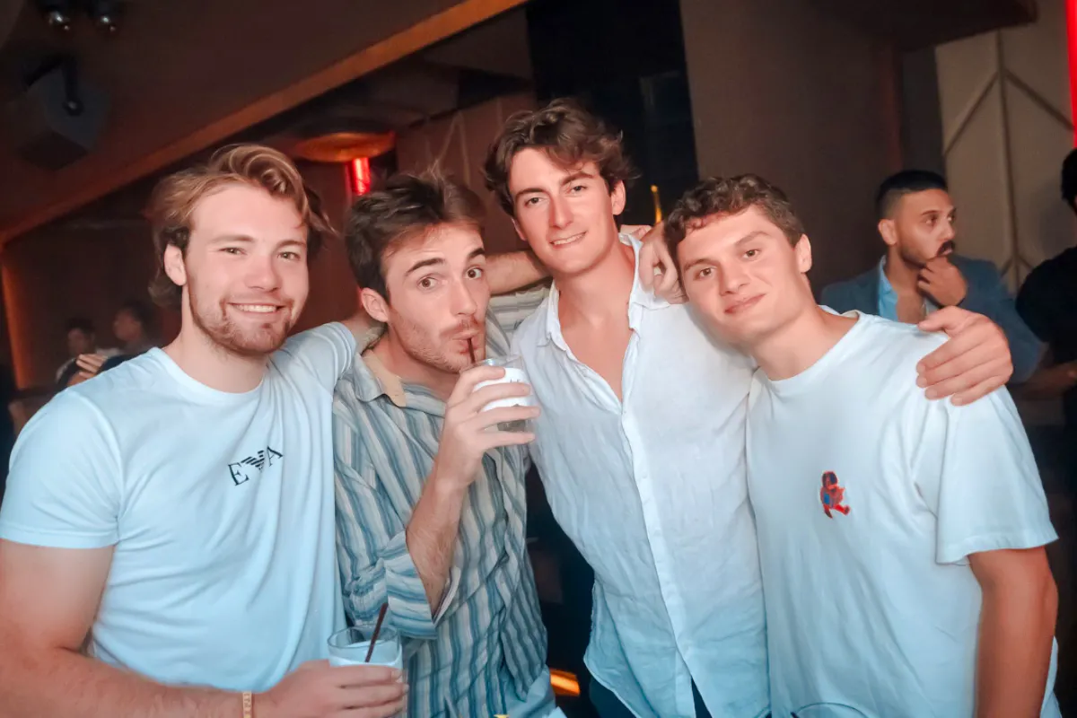 Group enjoying Bangkok rooftop pub crawl experience.