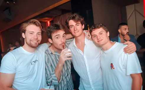 Group enjoying Bangkok rooftop pub crawl experience.