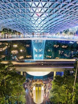Jewel Changi Airport indoor waterfall and lush greenery, Singapore.