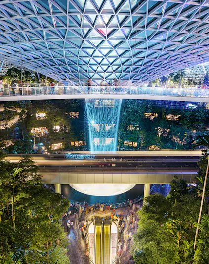 Jewel Changi Airport indoor waterfall and lush greenery, Singapore.