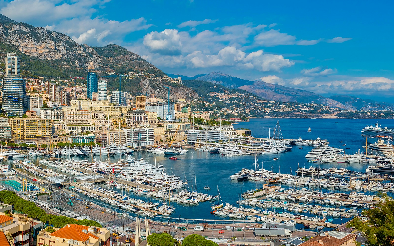 Tourists viewing the Monaco harbor and coastline on a French Riviera tour from Nice.