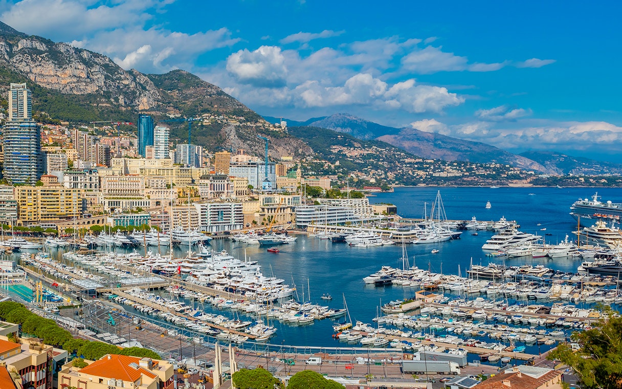 Tourists viewing the Monaco harbor and coastline on a French Riviera tour from Nice.