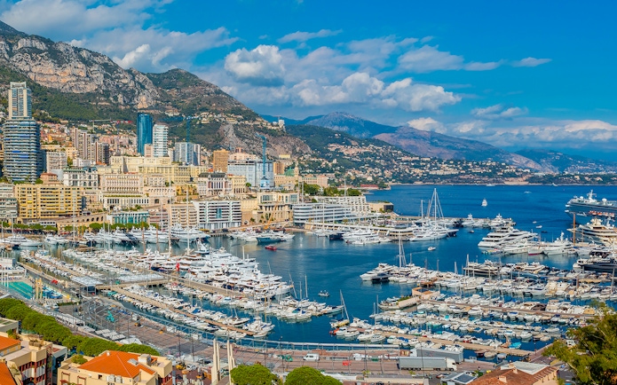 Tourists viewing the Monaco harbor and coastline on a French Riviera tour from Nice.