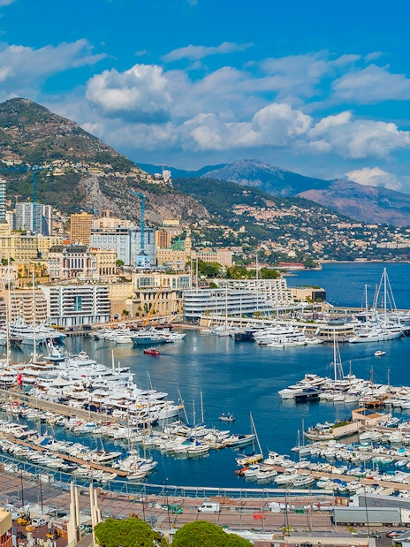Tourists viewing the Monaco harbor and coastline on a French Riviera tour from Nice.