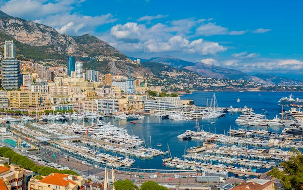 Tourists viewing the Monaco harbor and coastline on a French Riviera tour from Nice.