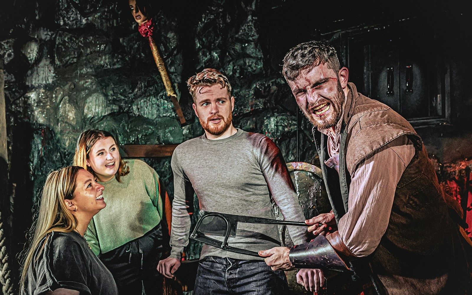 Visitors interacting with an actor at the London Dungeon experience.