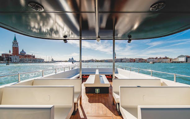 Boat tour view of San Giorgio Maggiore and Venice skyline, Italy.