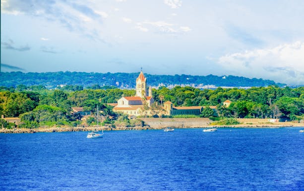 Lérins Islands view from a private boat tour departing Cannes, featuring a historic abbey.