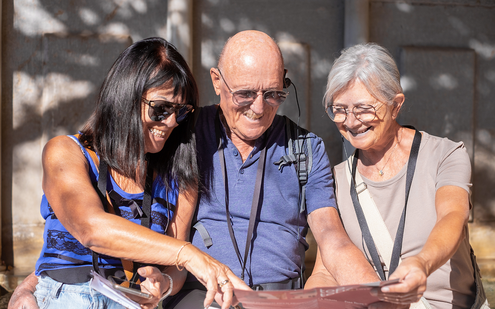 Visitors using audio guides at Knossos Palace Archaeological Site.
