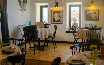 Dining area inside Pablo Neruda's Museum with tables and chairs, Isla Negra, Santiago.