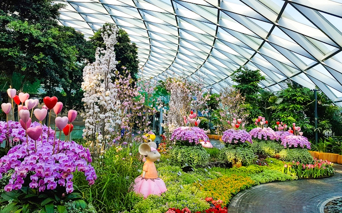 Petal Garden at Canopy Park, Jewel Changi, featuring vibrant flowers and whimsical sculptures.