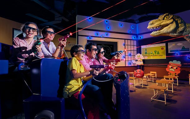 Visitors enjoying a laser tag ride at IMG World of Adventure, Dubai.