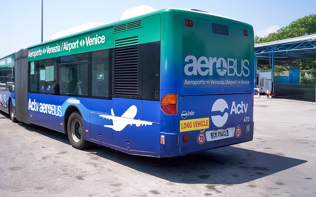 Venice Marco Polo Airport transfer bus parked at terminal.